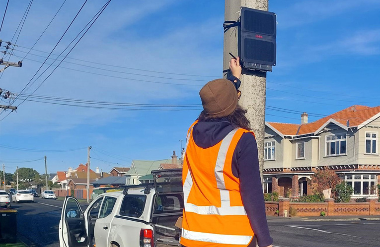 A sensor being installed to measure particulate matter as part of an air quality study